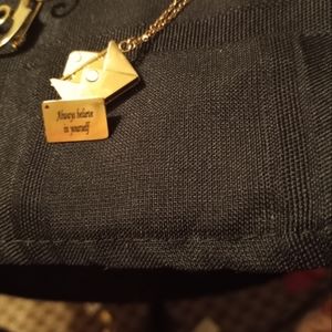 Rose gold love letterpendenton rose gold chain.also small hoop rosegold earings